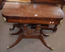 Regency period mahogany fold top card table applied throughout with brass mounts and ring handles