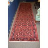 Modern Caucasian runner with multi-gull border, mainly red field, 420 x 107cm