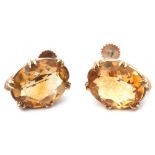 Pair of citrine set earrings, the oval faceted citrine multi-claw set in yellow metal basket