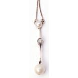 Precious metal cultured pearl and diamond pendant, a design featuring a small pearl suspended on a