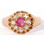 Early 20th century 18ct gold ruby and diamond cluster ring, the circular faceted cut ruby within a