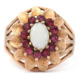9ct gold opal and ruby set cluster ring, a design featuring an oval cabochon opal raised within a