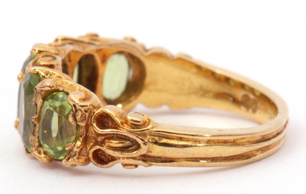 9ct gold five stone peridot ring, featuring five graduated oval cut peridots, claw set in carved - Image 2 of 8