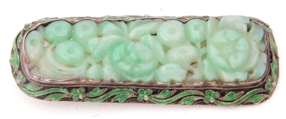 Chinese carved jade and enamel brooch, carved with a floral panel and framed in an enamel