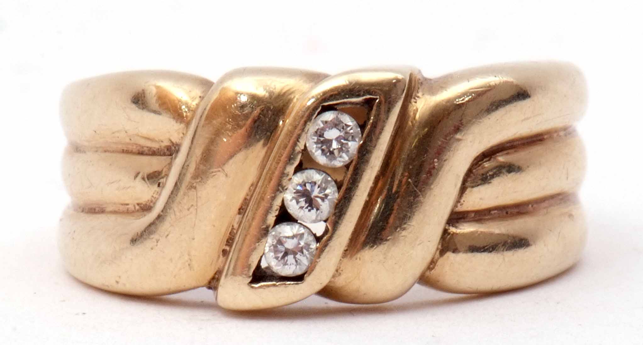 9ct gold and diamond ring, centring a line of three small brilliant cut diamonds between textured