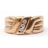 9ct gold and diamond ring, centring a line of three small brilliant cut diamonds between textured