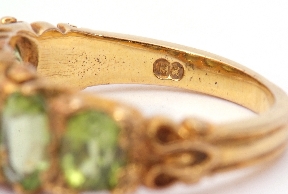 9ct gold five stone peridot ring, featuring five graduated oval cut peridots, claw set in carved - Image 7 of 8