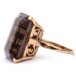 9ct stamped large smoky quartz ring of stepped cut rectangular shape, 2 x 1.5cm, four claw set and
