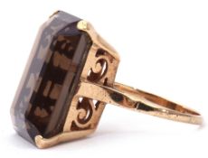 9ct stamped large smoky quartz ring of stepped cut rectangular shape, 2 x 1.5cm, four claw set and