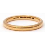 22ct gold wedding ring of plain polished design, size K, 2.7gms