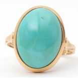 Turquoise set dress ring, the large oval cabochon turquoise in a rub-over setting in a plain
