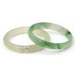 Mixed Lot: pale green jade bangle, 6cm diam (interior) together with a pale celadon quartz bangle (