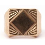 9ct gold gent's ring, a square panel with an engraved geometric design, with plain polished
