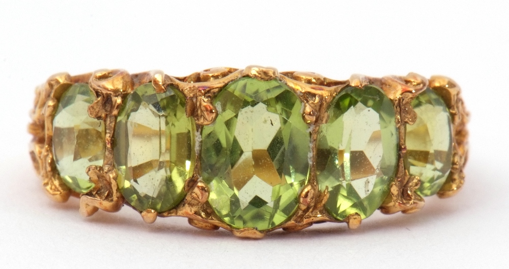9ct gold five stone peridot ring, featuring five graduated oval cut peridots, claw set in carved - Image 8 of 8