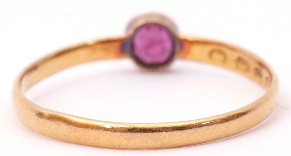 Antique 22ct gold ring with a small circular pink ruby in a collet setting, to a plain polished - Image 3 of 7