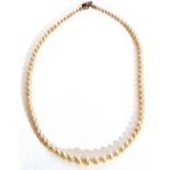 Cultured pearl necklace, a single row of graduated pearls, 2mm to 6mm diam to a metal clasp