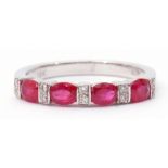 Modern ruby and diamond half-hoop ring, a design featuring 4 oval faceted rubies between 5 pairs
