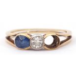 Antique diamond and sapphire ring, centring a brilliant cut diamond in rub-over setting and one oval