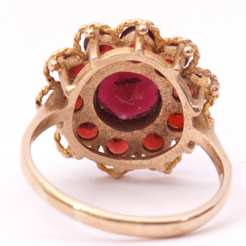 9ct gold garnet cluster ring, the central faceted round garnet within a small garnet surround, - Image 3 of 7