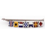 White metal and enamel flag signalling brooch featuring seven translucent enamel flags attached to a