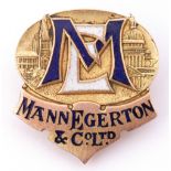 Early 20th century 9ct gold and enamel "Mann Egerton Co Ltd" buttonhole badge, Birmingham 1919,