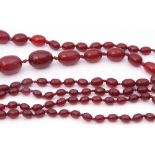 Vintage cherry amber bead necklace, a single row of graduated oblong shaped beads, 1cm to 3cm