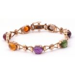 Cropp & Farr 9ct gold bracelet set with various cabochon gems to include amethyst, amber, peridot