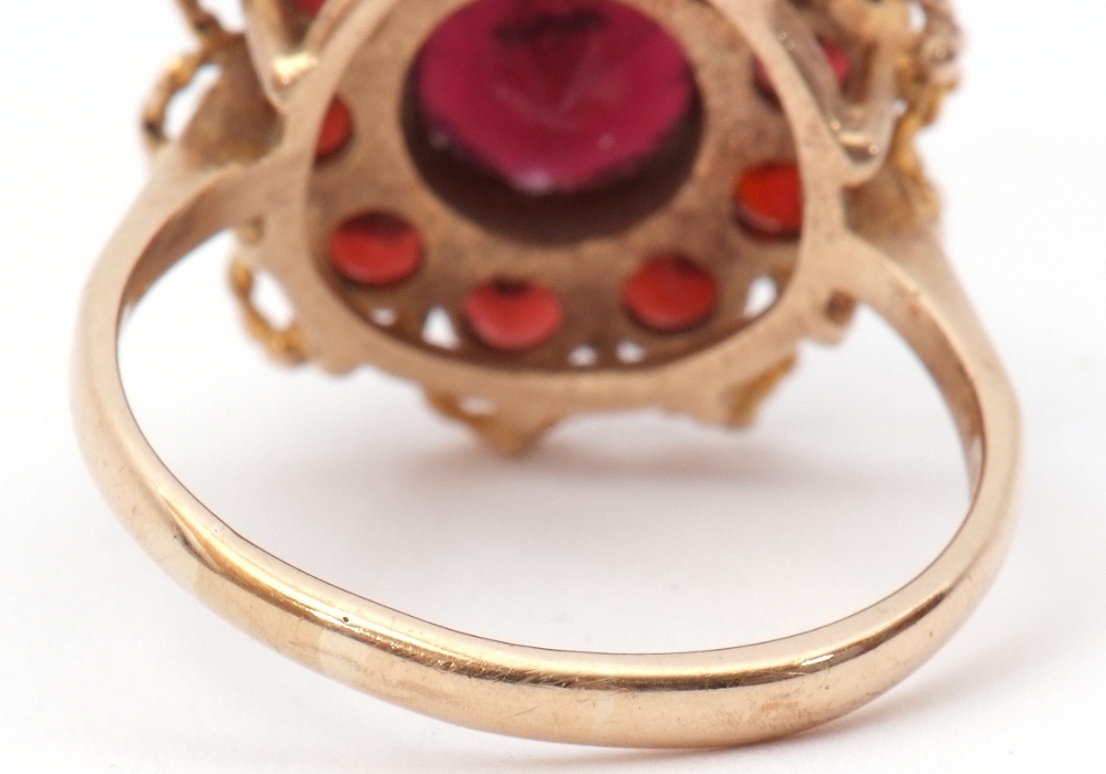 9ct gold garnet cluster ring, the central faceted round garnet within a small garnet surround, - Image 4 of 7