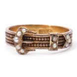 Antique 15ct stamped and seed pearl buckle ring, the band with a continuous beaded pattern with a