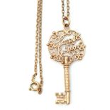 9ct gold "key" pendant, the pierced bow with "Happy Birthday", 4.5cm long, suspended from an oval