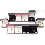 Ten boxed white metal (sterling) modern pendants to include zodiac and cubic zirconia examples