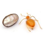 Mixed Lot: large gilt metal and amber set spider's brooch, together with a vintage nacre shell