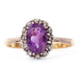 Antique amethyst and diamond cluster ring, the oval faceted amethyst within a surround of 12 small