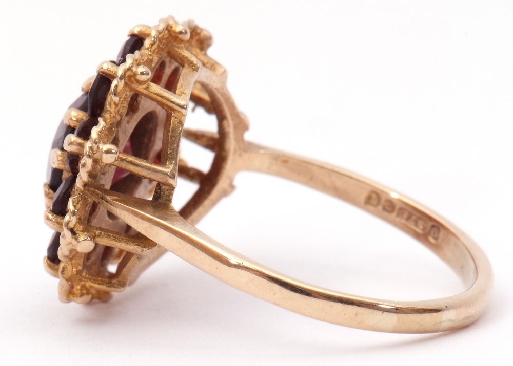 9ct gold garnet cluster ring, the central faceted round garnet within a small garnet surround, - Image 2 of 7