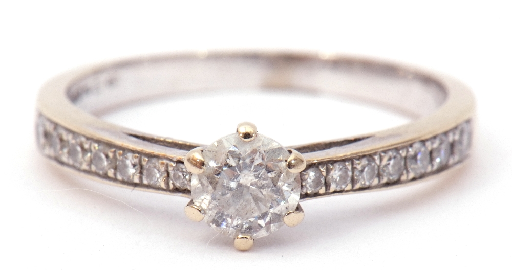 Precious metal diamond set ring, the central brilliant cut diamond 0.25ct approx in a coronet