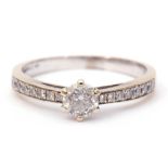 Precious metal diamond set ring, the central brilliant cut diamond 0.25ct approx in a coronet