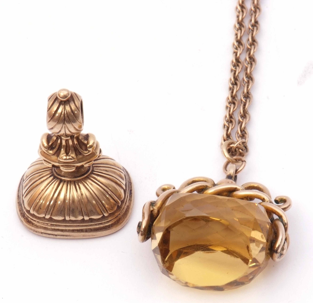 Mixed Lot: antique swivel faceted citrine fob in a yellow metal scroll mount suspended from a yellow