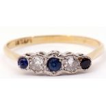 Sapphire and diamond five stone ring featuring 3 graduated matched sapphires and 2 round diamonds,