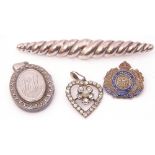 Mixed Lot: white metal oval hinged locket, a paste set heart pendant, a sterling stamped brooch, "