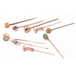 Mixed Lot: nine vintage stick pins, the finials with small diamond, amethyst, turquoise and sapphire
