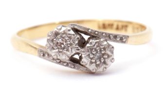 Precious metal diamond cross-over ring, featuring two small single cut diamonds in illusion