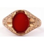 9ct gold gent's signet ring centring an oval shaped carnelian panel in a chased and engraved