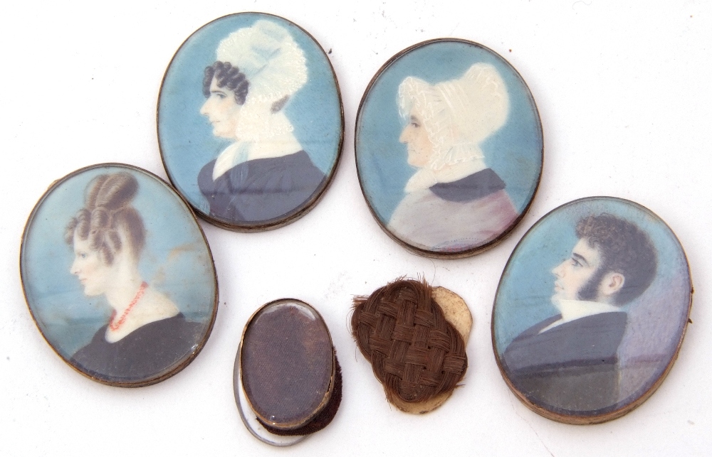 Four English School portrait miniatures to include a gent and three ladies, 2 x 2.5cm