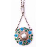 Murrle Bennett & Co white metal and enamel pendant of circular shape centring a bezel set mother