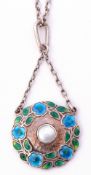 Murrle Bennett & Co white metal and enamel pendant of circular shape centring a bezel set mother