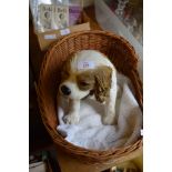 LARGE MODEL OF A KING CHARLES TYPE SPANIEL IN WICKER BASKET