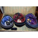 CASE CONTAINING THREE VINTAGE RIDING HATS