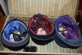 CASE CONTAINING THREE VINTAGE RIDING HATS