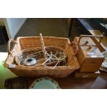 LARGE WICKERWORK BASKET AND SMALLER BASKET CONTAINING SERIES OF PLATE STANDS