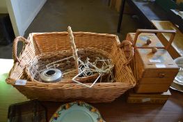 LARGE WICKERWORK BASKET AND SMALLER BASKET CONTAINING SERIES OF PLATE STANDS